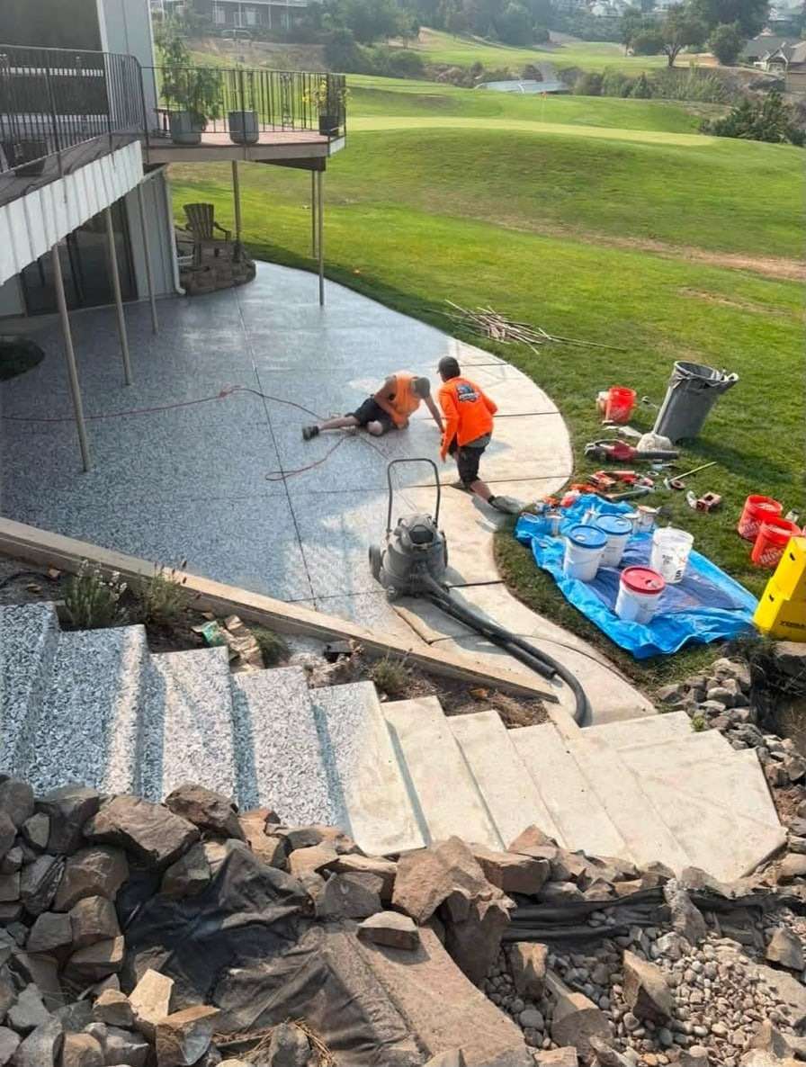 A contractor's patio job photo, half bare concrete and half Gravel flake, rendered by the Floor Visualizer